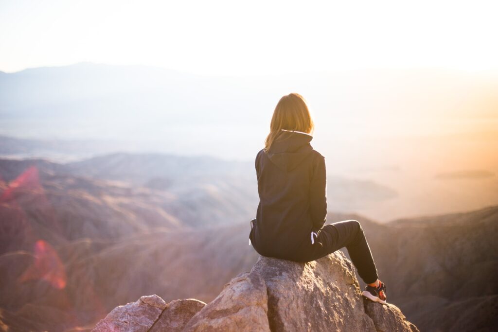 Woman contemplating in the mountains