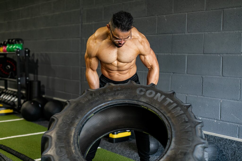 Strongman filipping a tire