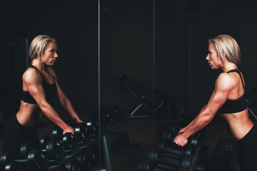 Woman lifting dumbbells