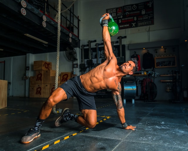 An athlete training with a kettlebell