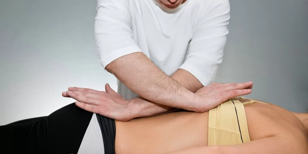 A chiropractor performing spinal manipulation