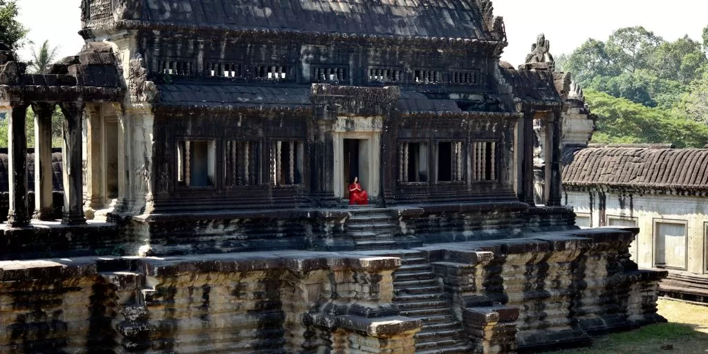 A woman meditating in a temple