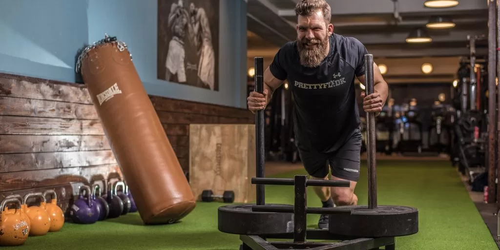 A man performing physical training to boost his mental performance