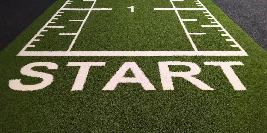 The word "START" painted at the beginning of an athletic track