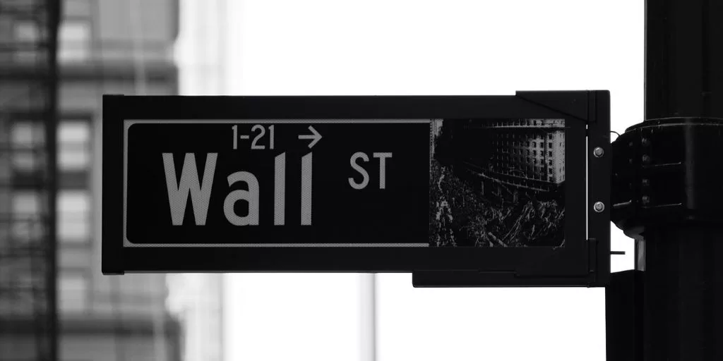 A street sign saying "Wall Street"