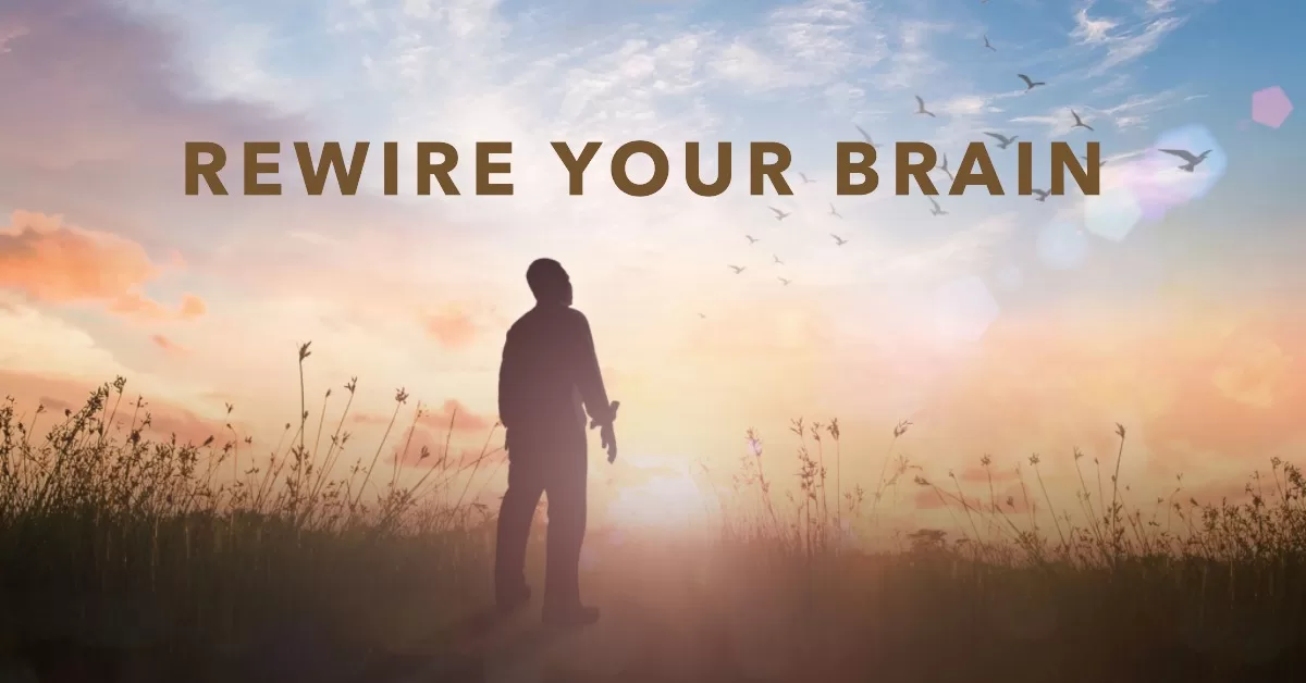 Rewire your brain! - A happy man looking at the sun