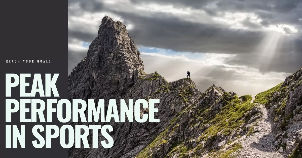 Reaching sports goals - A mountain climber reaching the top of a mountain