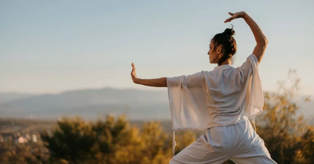 A Spiritual Woman Practicing Tai Chi in Nature