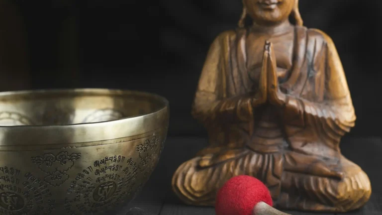 A Buddha figurine and a singing bowl