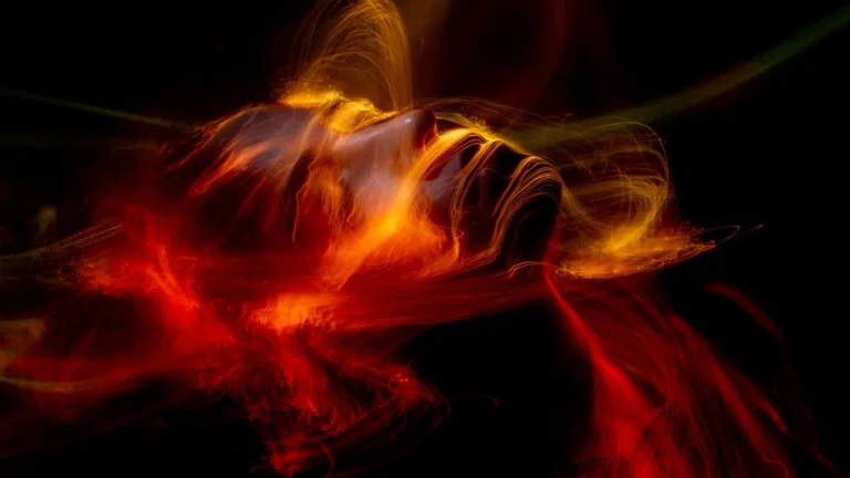 Etheric aura (biofield) covering an emerging human face