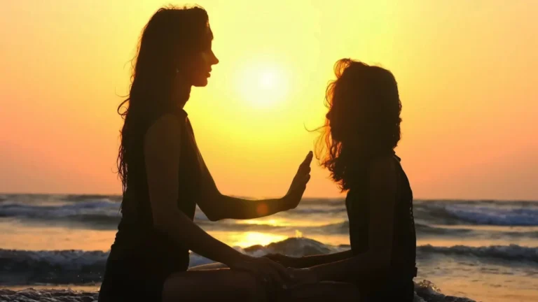A woman helping a young girl deal with her emotional pain