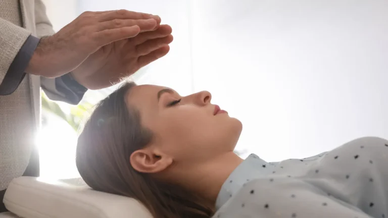 Energy healer during an energy healing session with a patient