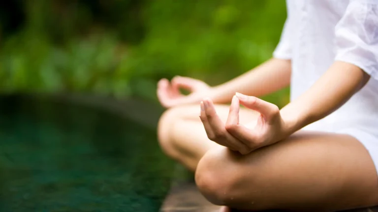 Woman meditating in a natural setting