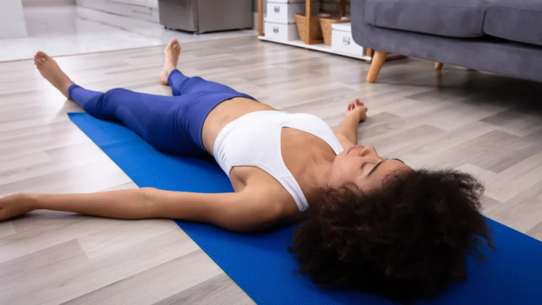 Progressive Muscle Relaxation practiced on a yoga mat