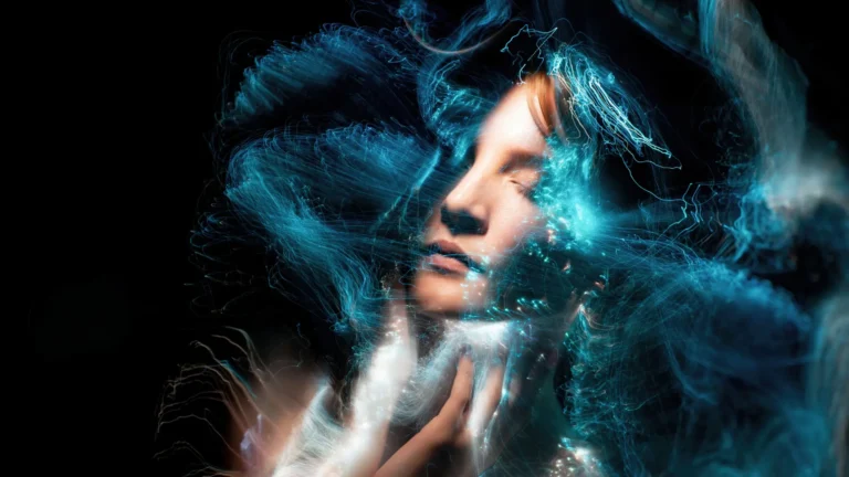 A woman in the dark surrounded by hypnotizing ethereal patterns