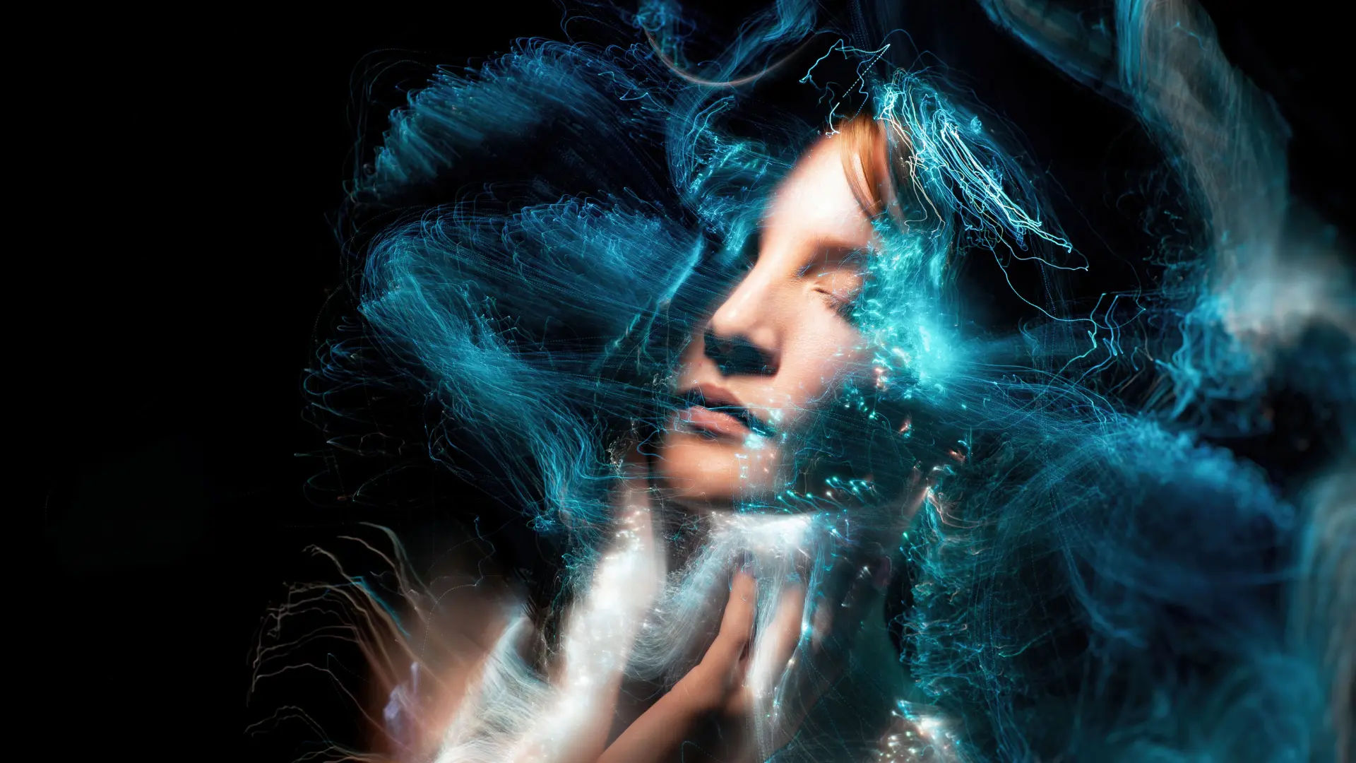 A woman in the dark surrounded by hypnotizing ethereal patterns