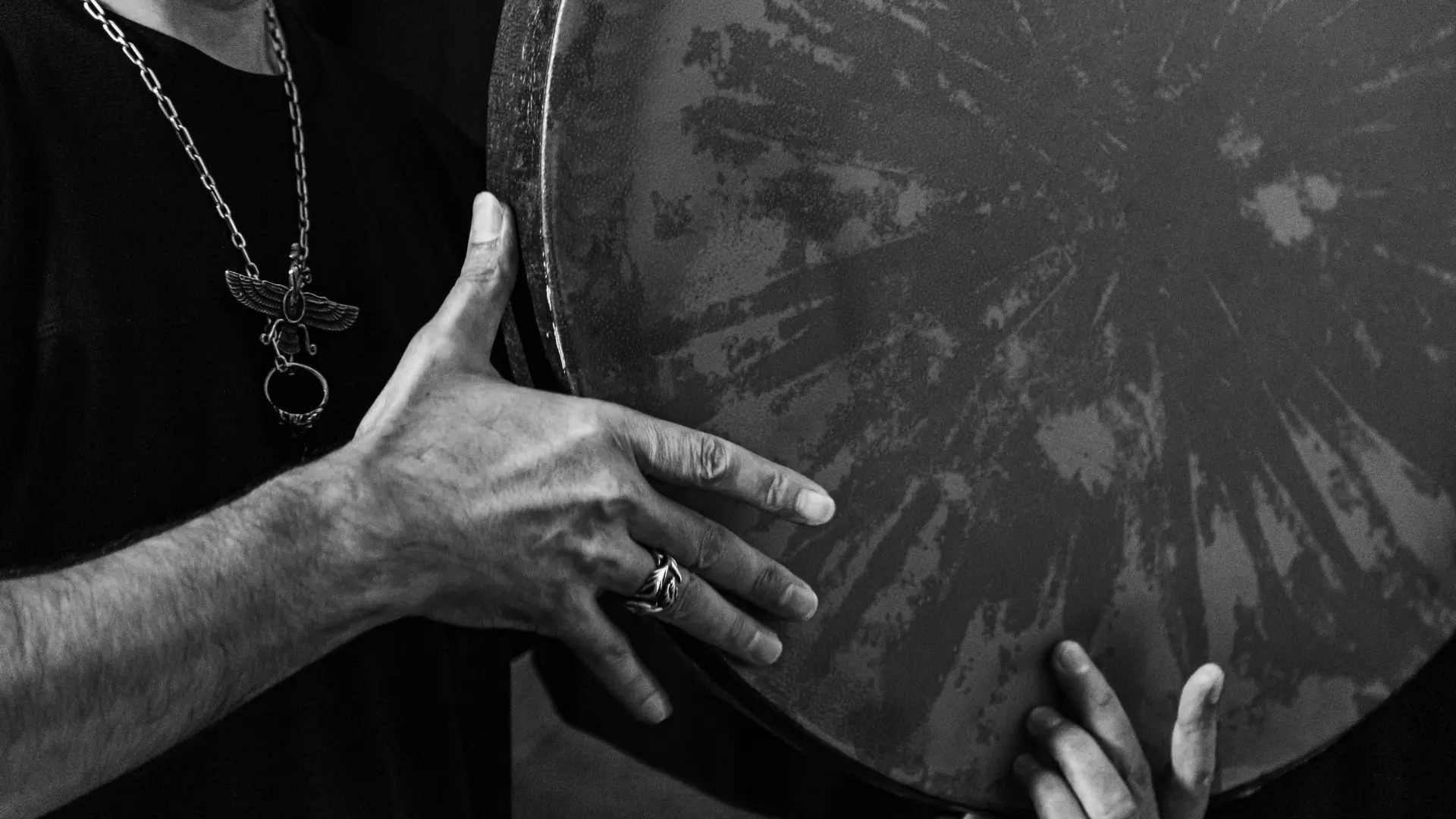 A shaman healer drumming the drum to achieve a trance state, preparing to venture on a shamanic journey