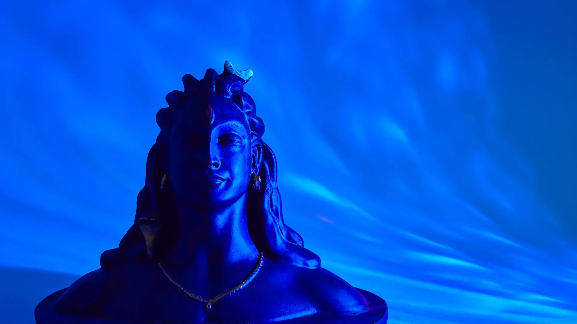 Shiva figurine on a black background symbolizing the divine