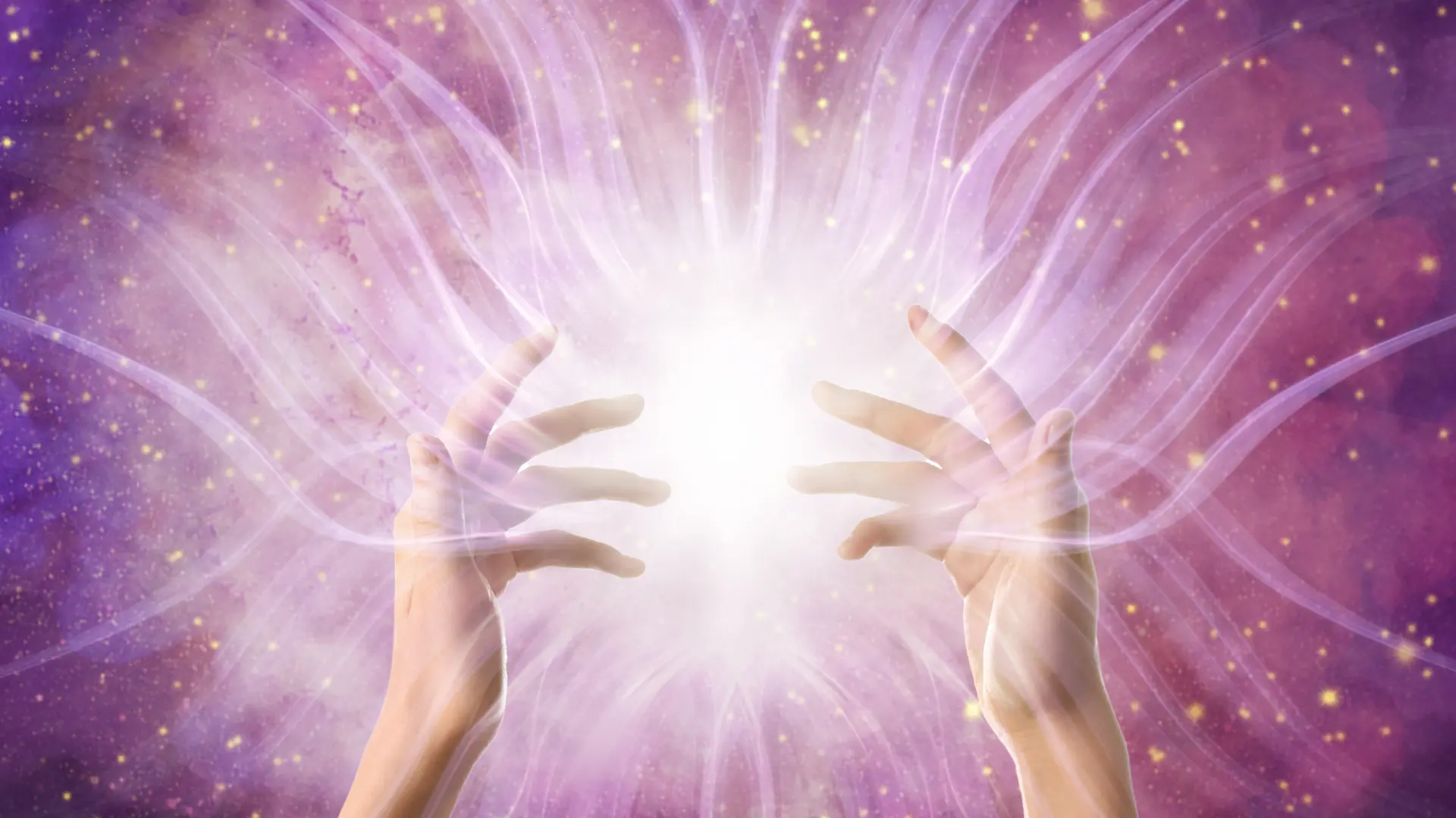 The hands of an angelic healer emitting divine energy