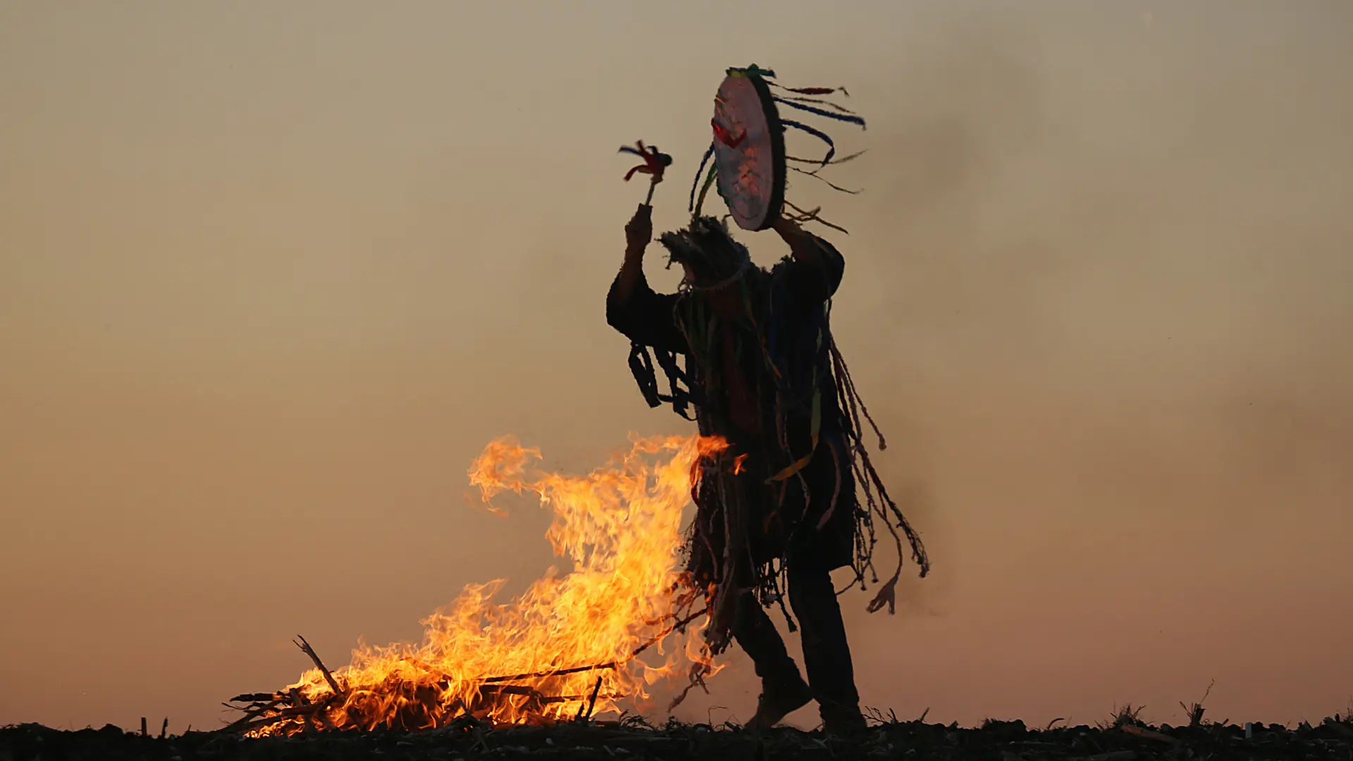 Shamanic healer drumming the drum